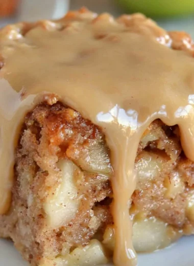 Deliciously moist Apple Dapple Cake with apples and pecans topped with caramel