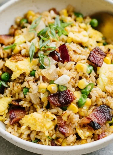 Delicious breakfast fried rice garnished with vegetables and eggs