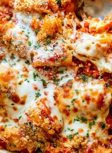 Delicious Chicken Parmesan Casserole served with cheese and marinara sauce