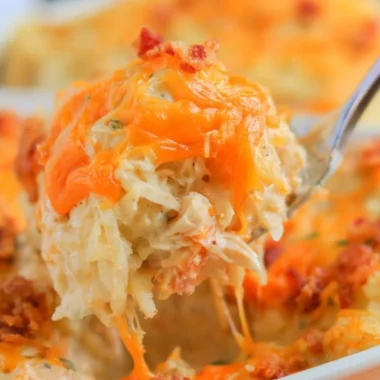 Baked Crack Chicken Casserole topped with cheese and herbs