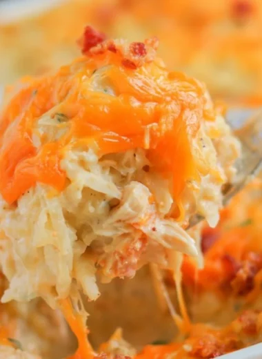Baked Crack Chicken Casserole topped with cheese and herbs