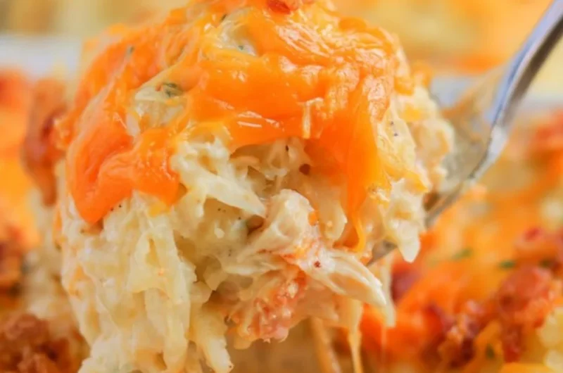 Baked Crack Chicken Casserole topped with cheese and herbs