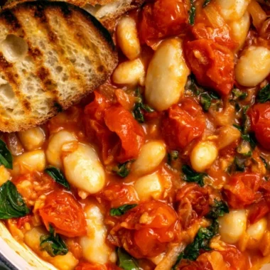 Creamy tomato basil butter beans dish served in a bowl
