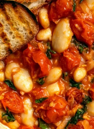Creamy tomato basil butter beans dish served in a bowl