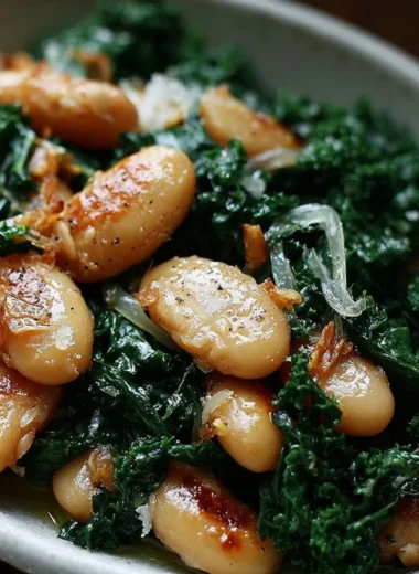A plate of pan-fried beans with kale, showcasing vibrant colors and healthy ingredients.