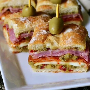 Delicious New Orleans style muffaletta sandwich bites on a platter