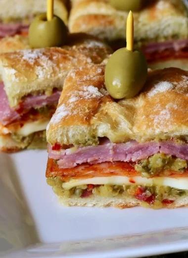 Delicious New Orleans style muffaletta sandwich bites on a platter